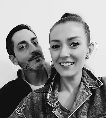 Portrait of Anna and Andrea, Unfoolit founders, standing confidently against a neutral background.